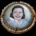 Mrs. Audrey Fisher commissioned Jennifer to paint these portraits as a birthday gift to her mother. They were painted on mother of pearl, and encased in German crystal, surrounded by tiny pearls. The daughters images are earrings. The Mother, Elsie, is a broche. They are tiny. The faces are 5/8