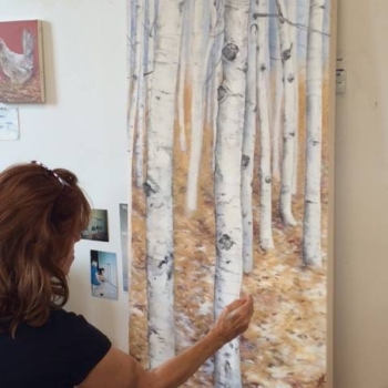Jennifer paints a birch forest.