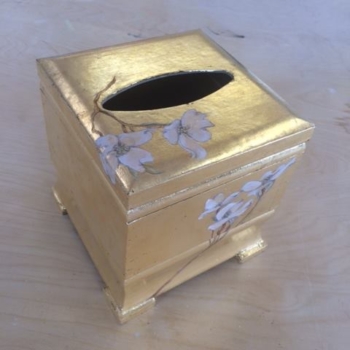 Gold-gilded tissue box.