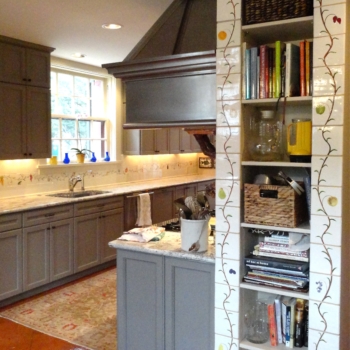 Hand-painted tiles beautify this kitchen wall cabinet.
