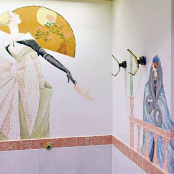 Vogue-style murals in a public restroom.