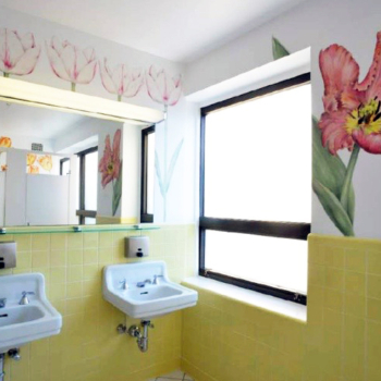 Flower murals in a public restroom.