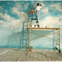 'Duane’s Sky' is a 20x50’ backdrop created for renowned photographer Duane Rieder in his Pittsburgh studio. This airy effect was commissioned for a United Airlines print campaign, and was painted directly onto a cyclorama wall. It has subsequently been utilized in many other photo shoots. That's Jennifer with her head in the clouds.